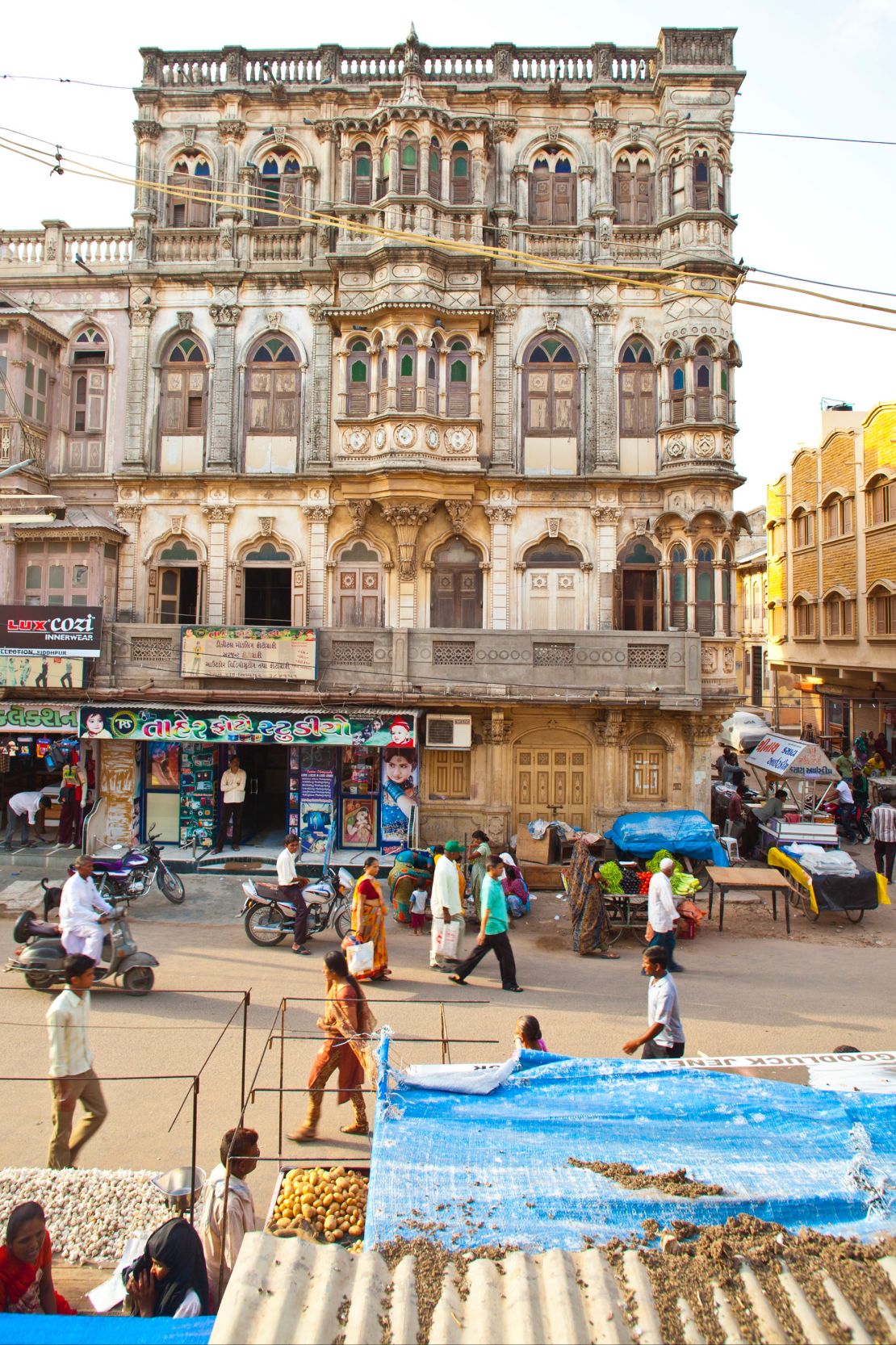 The buildings contain various elements of European architecture, including gabled roofs, pilasters and columns.