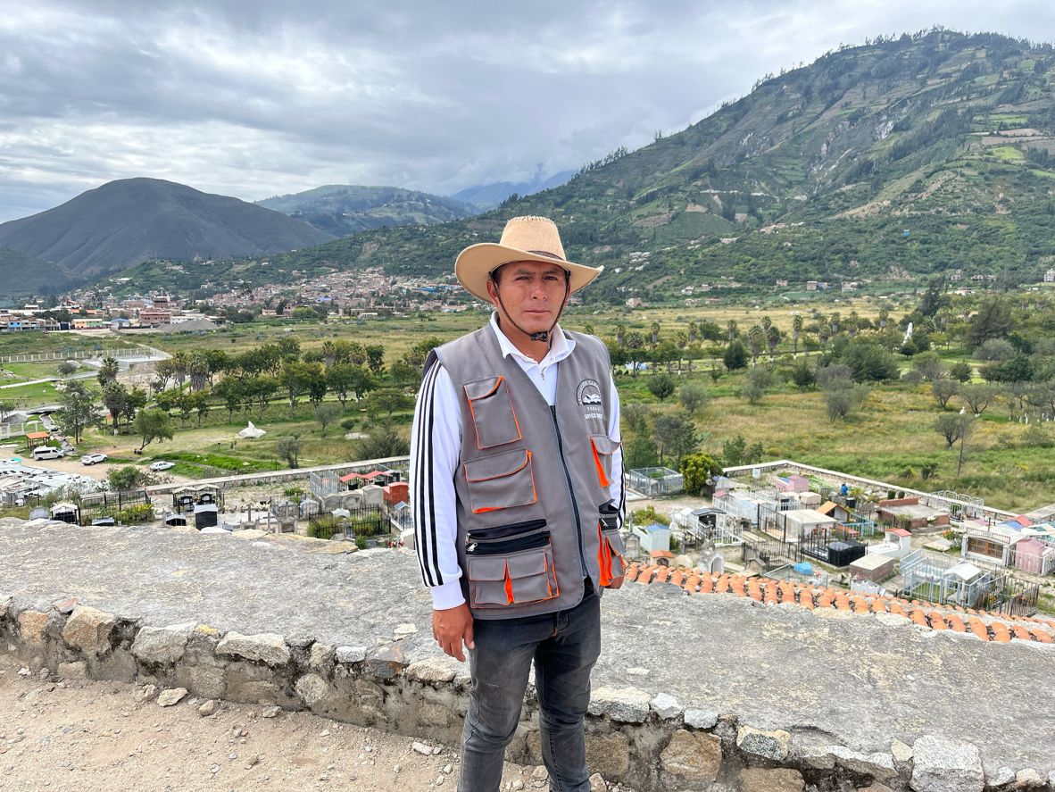<strong>Survivor's son:</strong> Local guide Juan Márquez Sánchez stands on Yungay’s cemetery hill where his father sought refuge to survive the devastating avalanche in 1970.