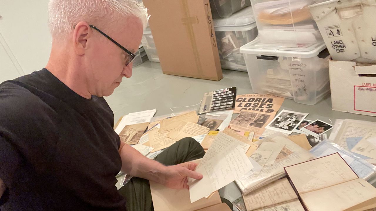 Anderson Cooper looks through boxes that belonged to his mother.