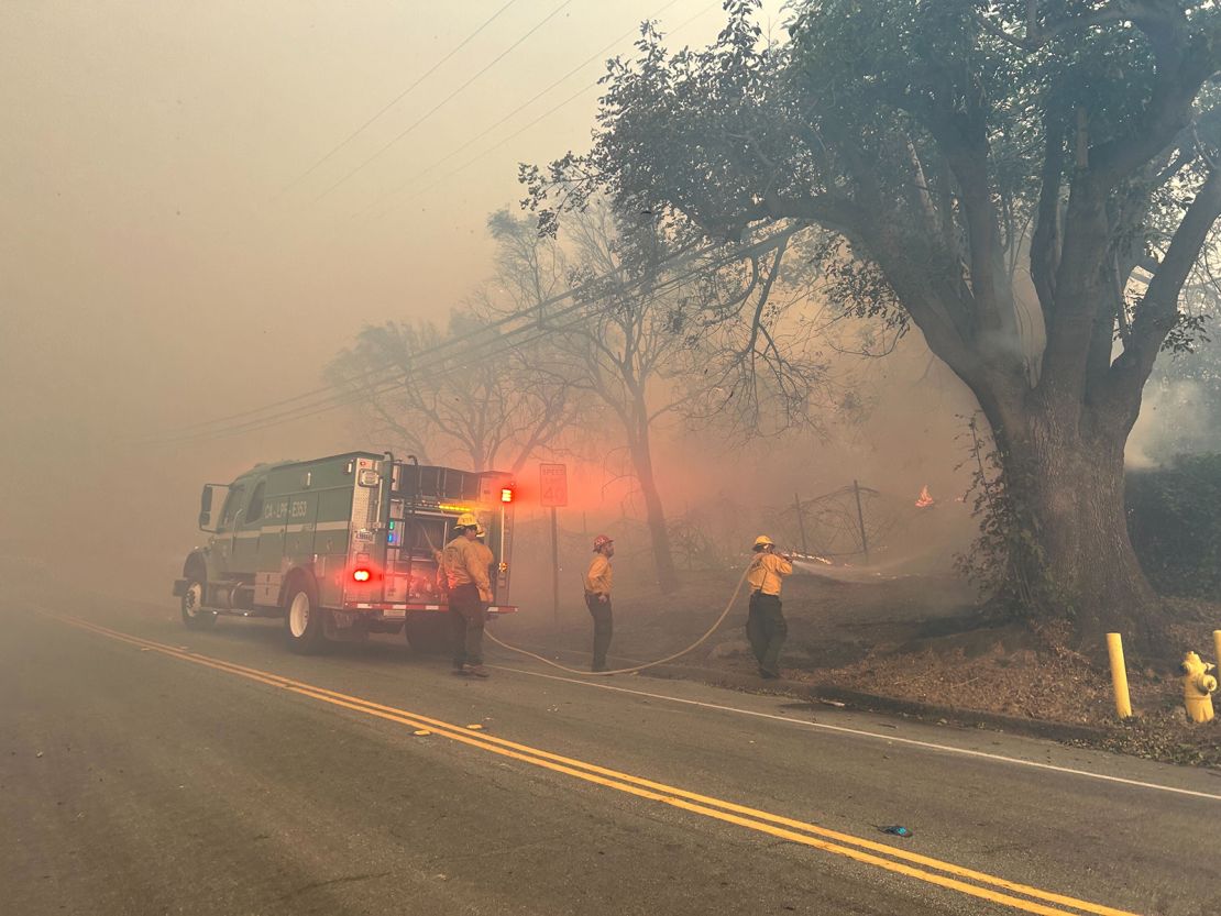 Firefighters work to contain the Mountain Fire Wednesday.