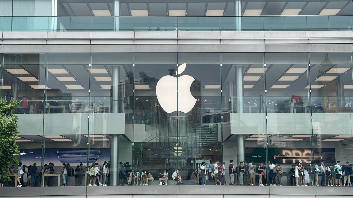 Customers line up inside the Apple Store at the International Financial Centre mall in Hong Kong when iPhone 16 goes on sale on September 20, 2024.