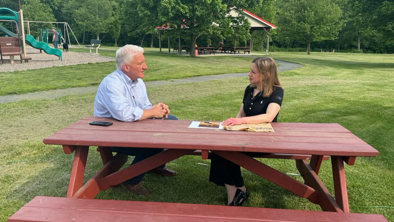 John King talks with Pennsylvania voter Joan London in Berks County, Pennsylvania.