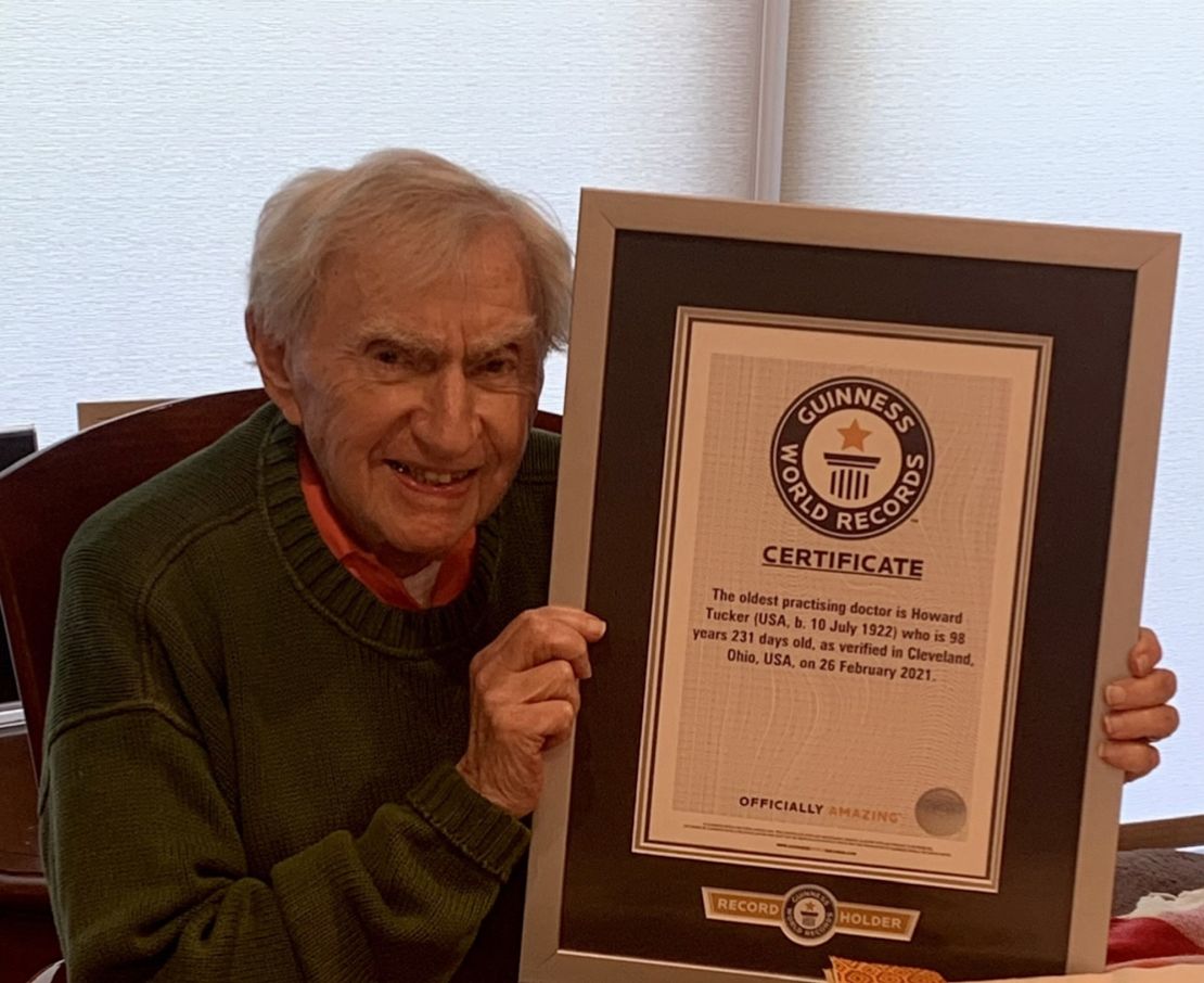 Howard Tucker shows off his Guiness World Record certificate designating him the "oldest practicing doctor."