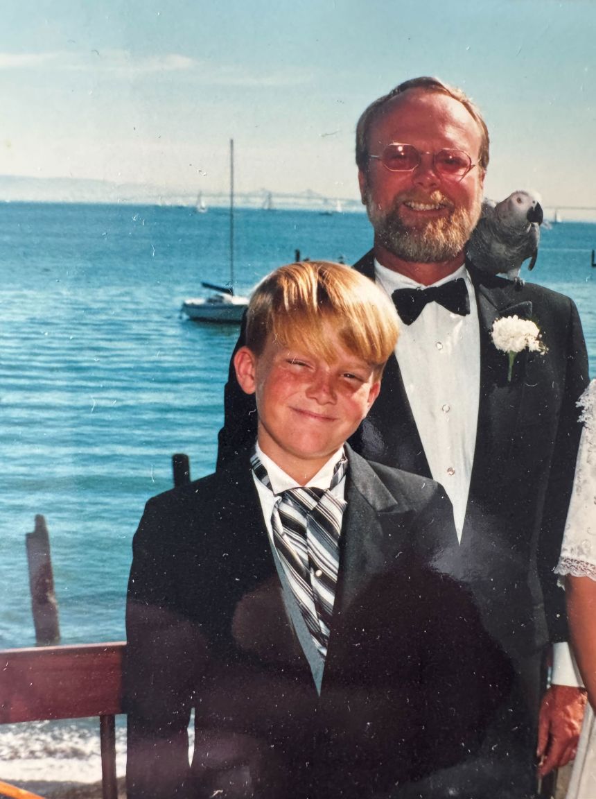 Jake Scott and his father, Marvin Scott, and the bird that often sat on Marvin Scott's shoulder.