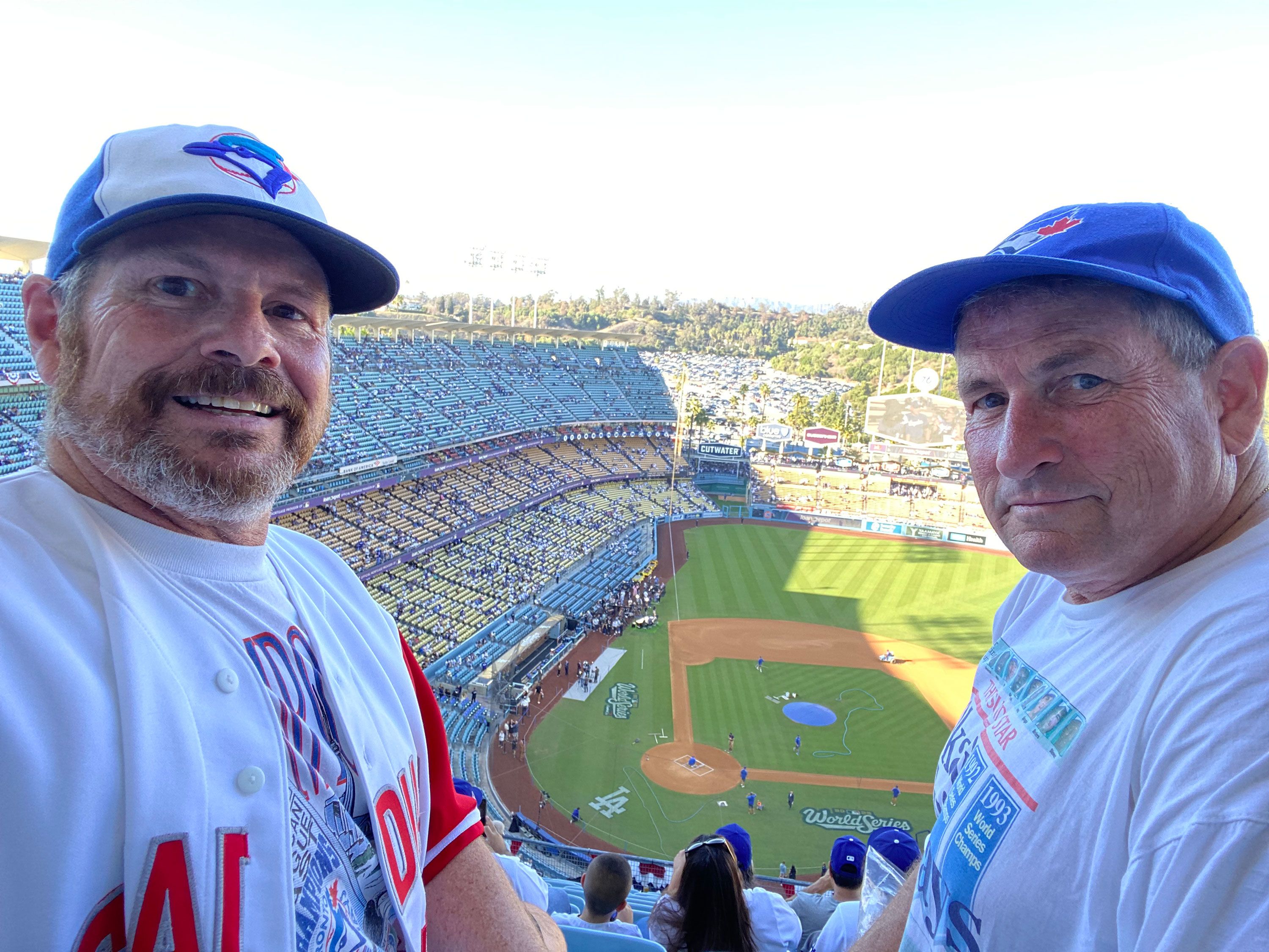 Grant Murray, left, and his brother Kevin at the Jays World Series game against the Dodgers Tuesday night. Vancouver resident Grant Murray had been avoiding his normal travels to the United States this year due to the US-Canadian trade dispute. But the Jays