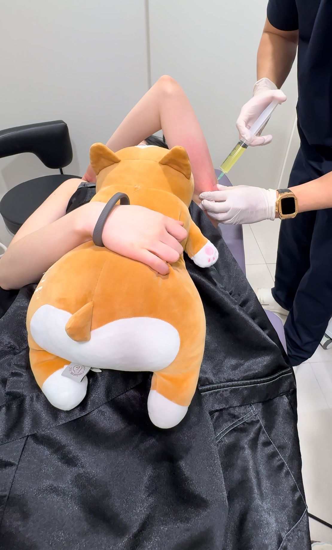 Lee undergoes a beauty treatment in South Korea. This one came with an emotional support plushie.