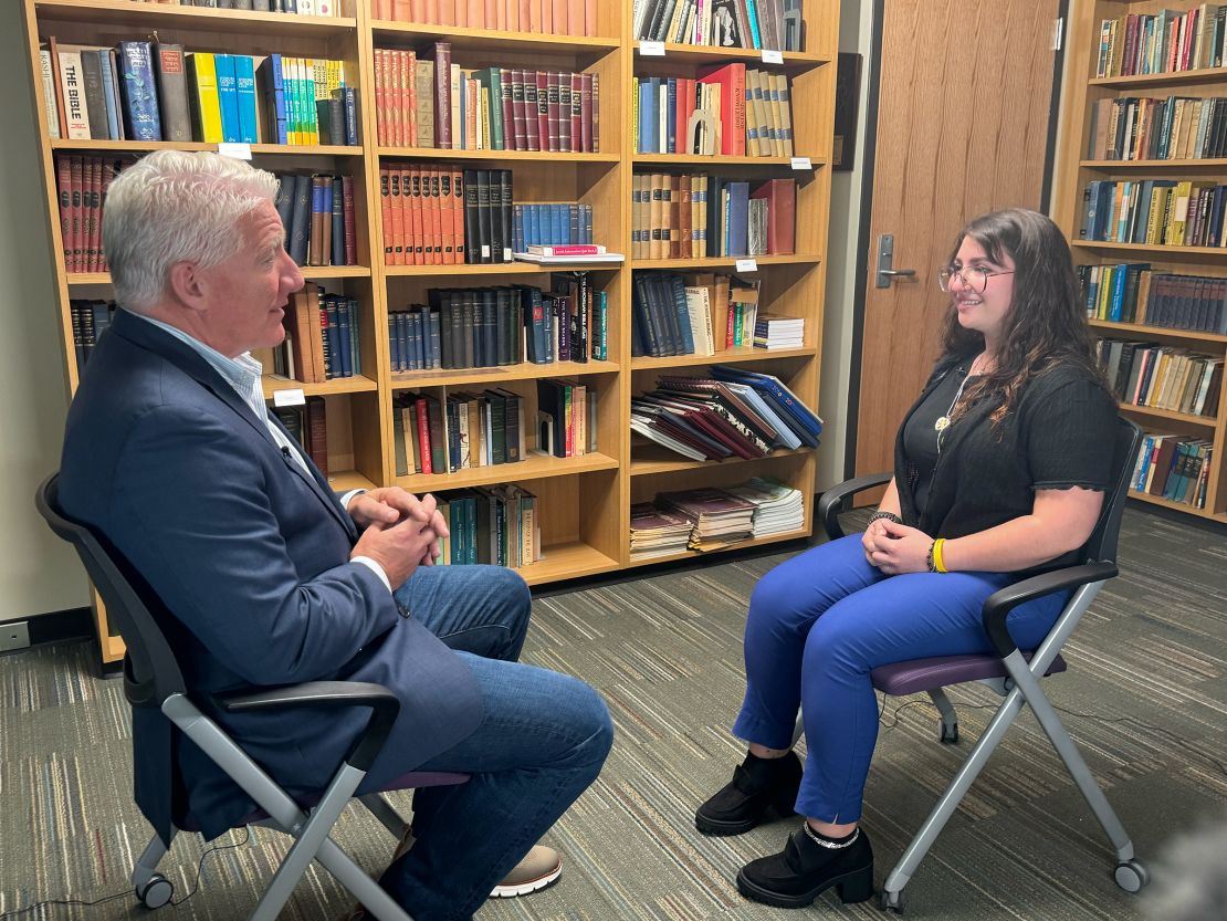 Wayne State student Maya Siegmann talks with John King on campus in Detroit, Michigan.