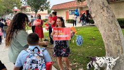 Teachers greet families outside Brooklyn Avenue School in Los Angeles on August 14.