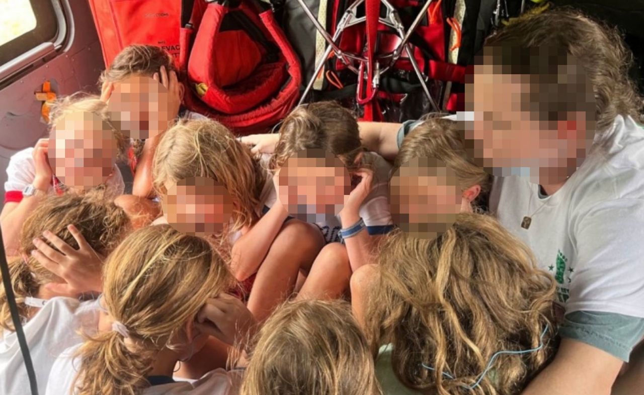 Young campers and a counselor were evacuated by helicopter from Camp Mystic Friday after floods impacted the area, as shown in a photo obtained by CNN from a local official. Faces have been obscured by CNN to protect the privacy of those shown.
