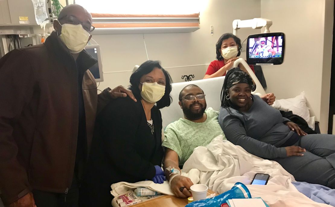 Torrence Irvin (third from left) says he lost so much weight that he was hardly recognizable to his family and friends when they visited him in the hospital.
