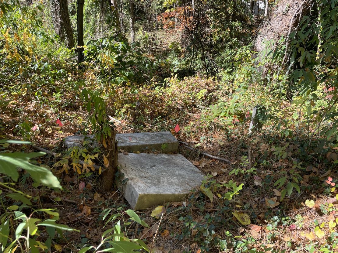 A broken headstone is seen at the Piney Grove Cemetery in Atlanta.
