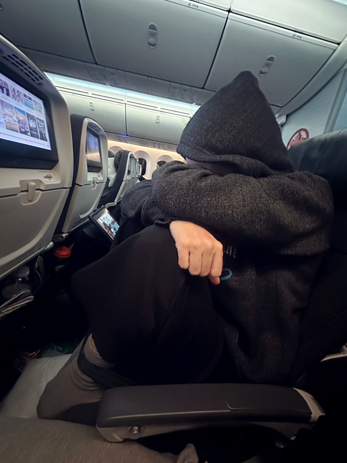 Travelers have been sharing videos of themselves buckling their seatbelts around their ankles to keep their feet in place, claiming it helps them sleep during flights. Experts say it's extremely dangerous.