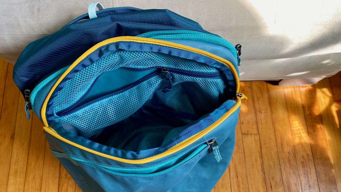 A photo of an open exterior pocket on the Cotopaxi Allpa 35L Travel Pack