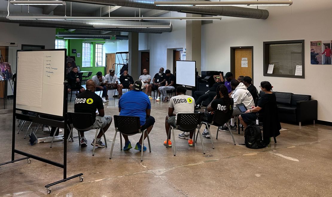 Members of Roca, a referral partner in the Group Violence Reduction Strategy, gather for a morning meeting at the organization’s Baltimore site.