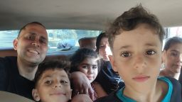 Hani Almadhoun with his family in Gaza, during a visit over summer. His nephews Omar (next to Hani) and Ali (closest to camera) were among those who died during airstrikes last week.