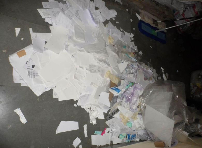 Photos from an FDA inspection show discarded and shredded records.