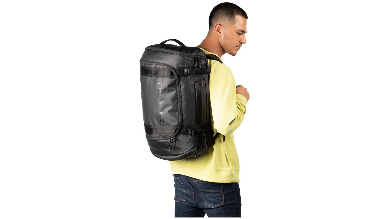 A photo of a person wearing the Timbuk2 Impulse Travel Backpack Duffel