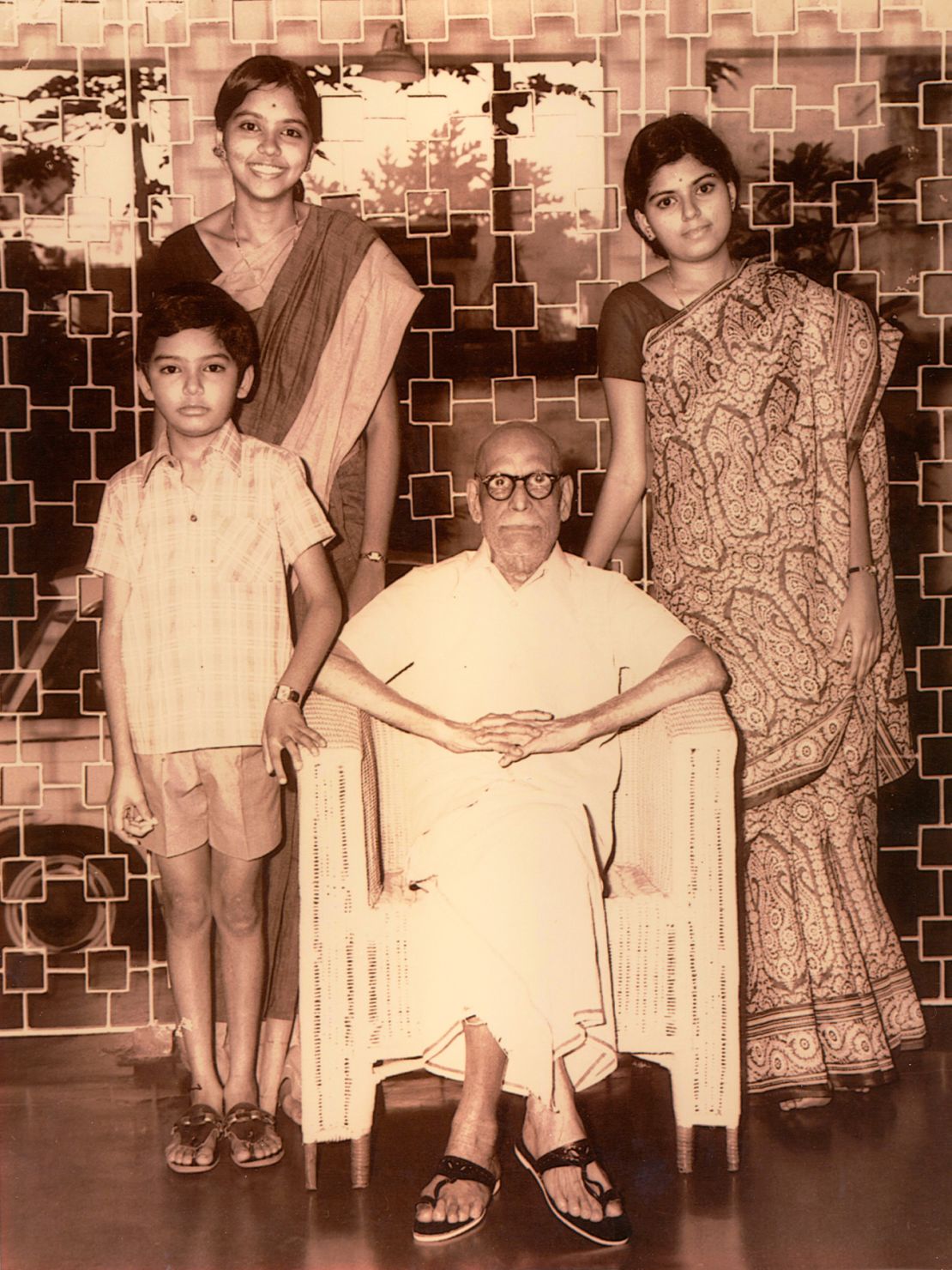 Indra, aged 14 (on the left) with her paternal grandfather who she called Thatha and her siblings Chandrika and Nandu.