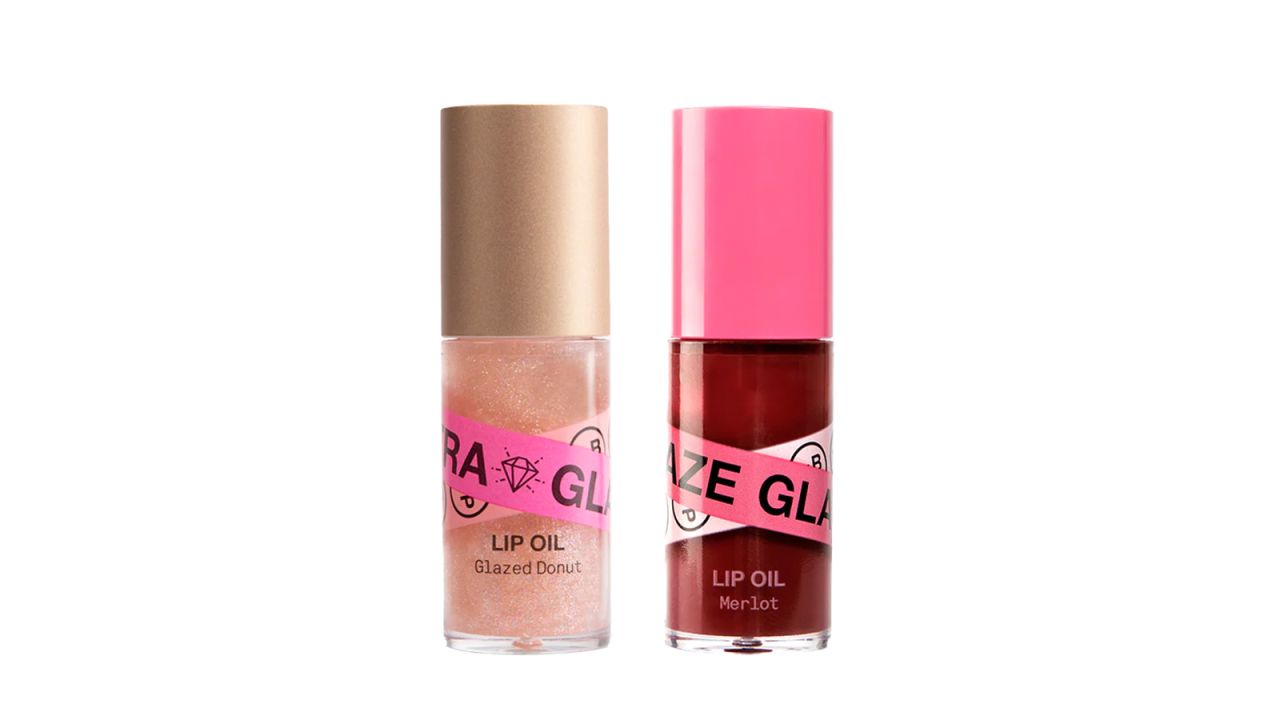 Two bottles of lip oil on a white background.