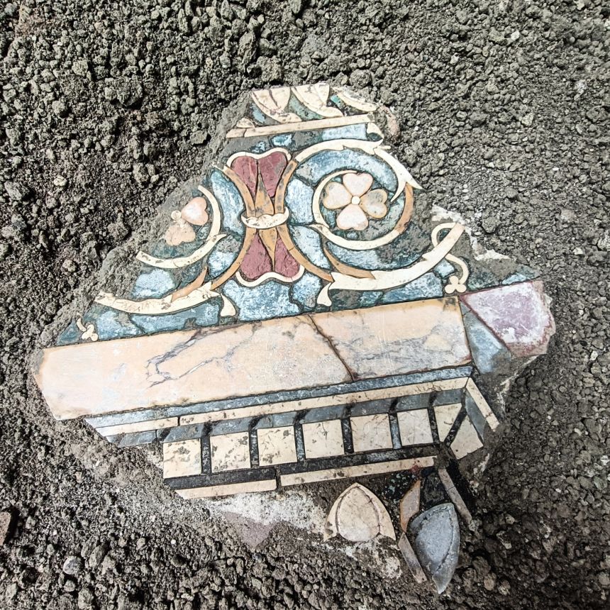Fragment of Roman marble flooring found on top of the volcanic deposits that was reused.