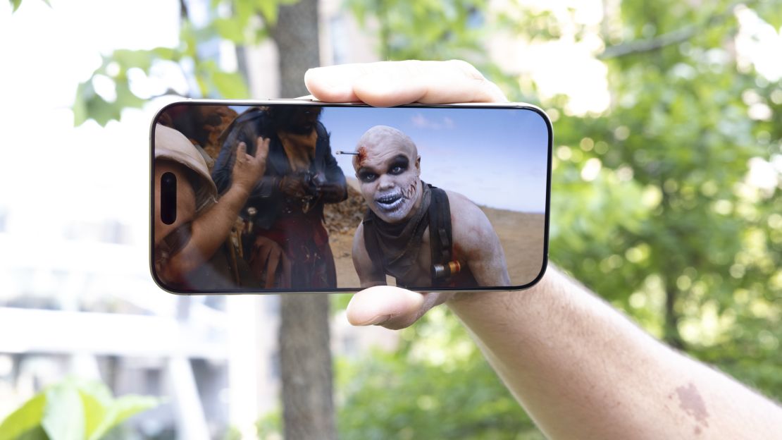 An iPhone 16 Pro shows the movie Furiosa, in a scene with Sean Millis' The Lone War Boy.