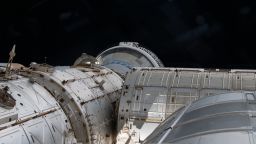 iss071e171115 (June 6, 2024) --- This view from a window on the cupola overlooks a portion of the International Space and shows the partially obscured Starliner spacecraft from Boeing docked to the Harmony module's forward port.