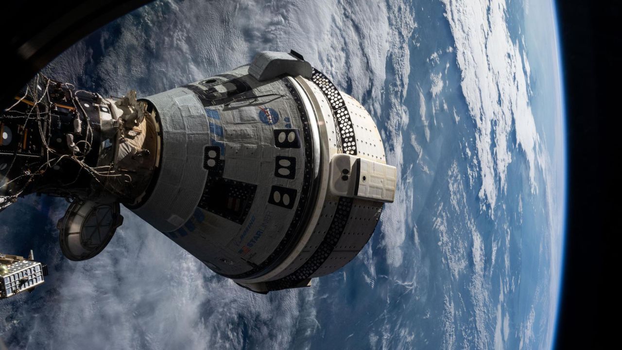 iss071e265103 (July 3, 2024) --- Boeing's Starliner spacecraft that launched NASA's Crew Flight Test astronauts Butch Wilmore and Suni Williams to the International Space Station is pictured docked to the Harmony module's forward port. This view is from a window on the SpaceX Dragon Endeavour spacecraft docked to the port adjacent to the Starliner. 