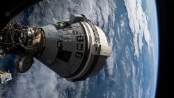 iss071e265103 (July 3, 2024) --- Boeing's Starliner spacecraft that launched NASA's Crew Flight Test astronauts Butch Wilmore and Suni Williams to the International Space Station is pictured docked to the Harmony module's forward port. This view is from a window on the SpaceX Dragon Endeavour spacecraft docked to the port adjacent to the Starliner.