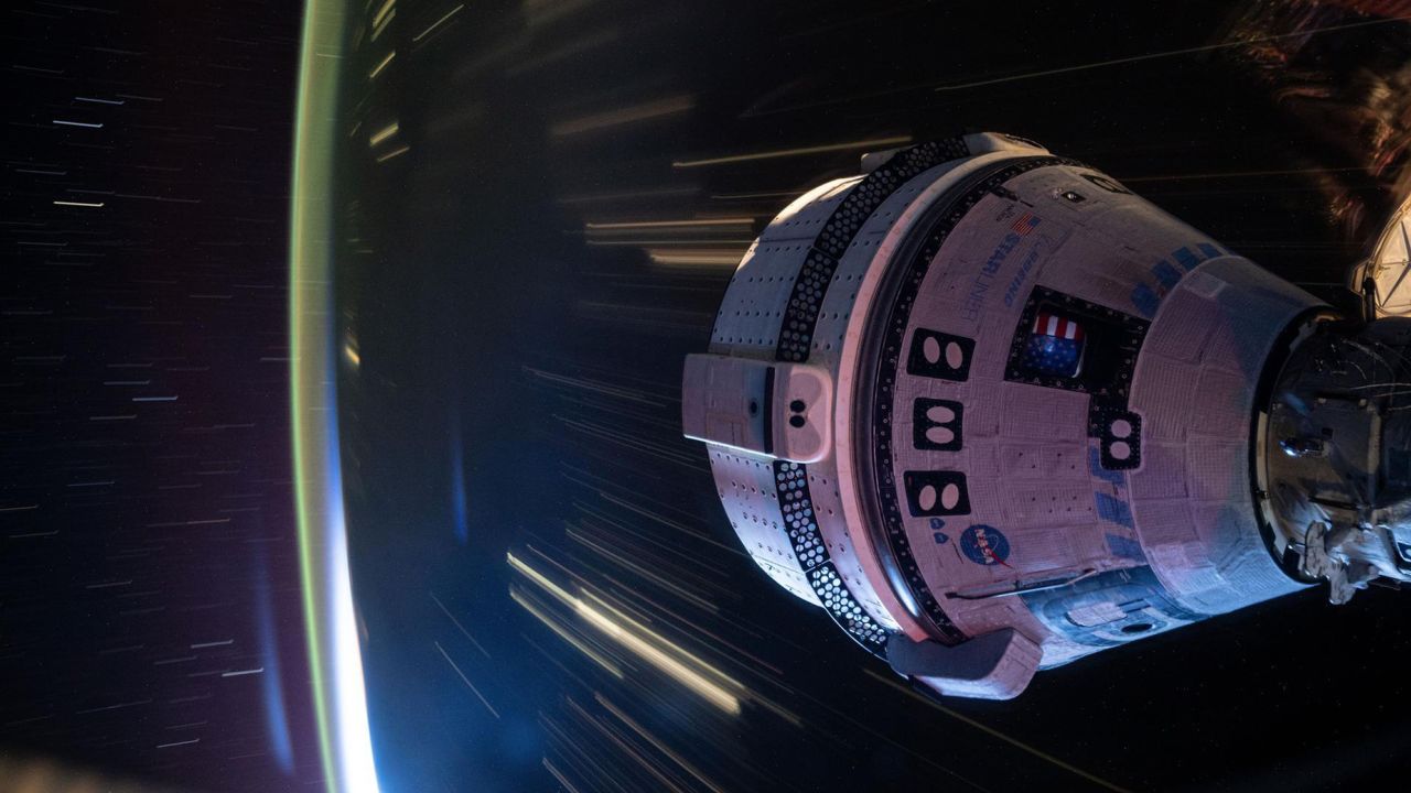 Boeing’s Starliner spacecraft that launched NASA’s Crew Flight Test astronauts Butch Wilmore and Suni Williams to the International Space Station is pictured docked to the Harmony module’s forward port. This long-duration photograph was taken at night from the orbital complex as it soared 258 miles above western China.