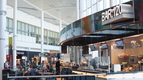 A photo of passenger dining at the BAR:120 restaurant in the terminal at Toronto Pearson International Airport (YYZ) in Ontario, Canada.