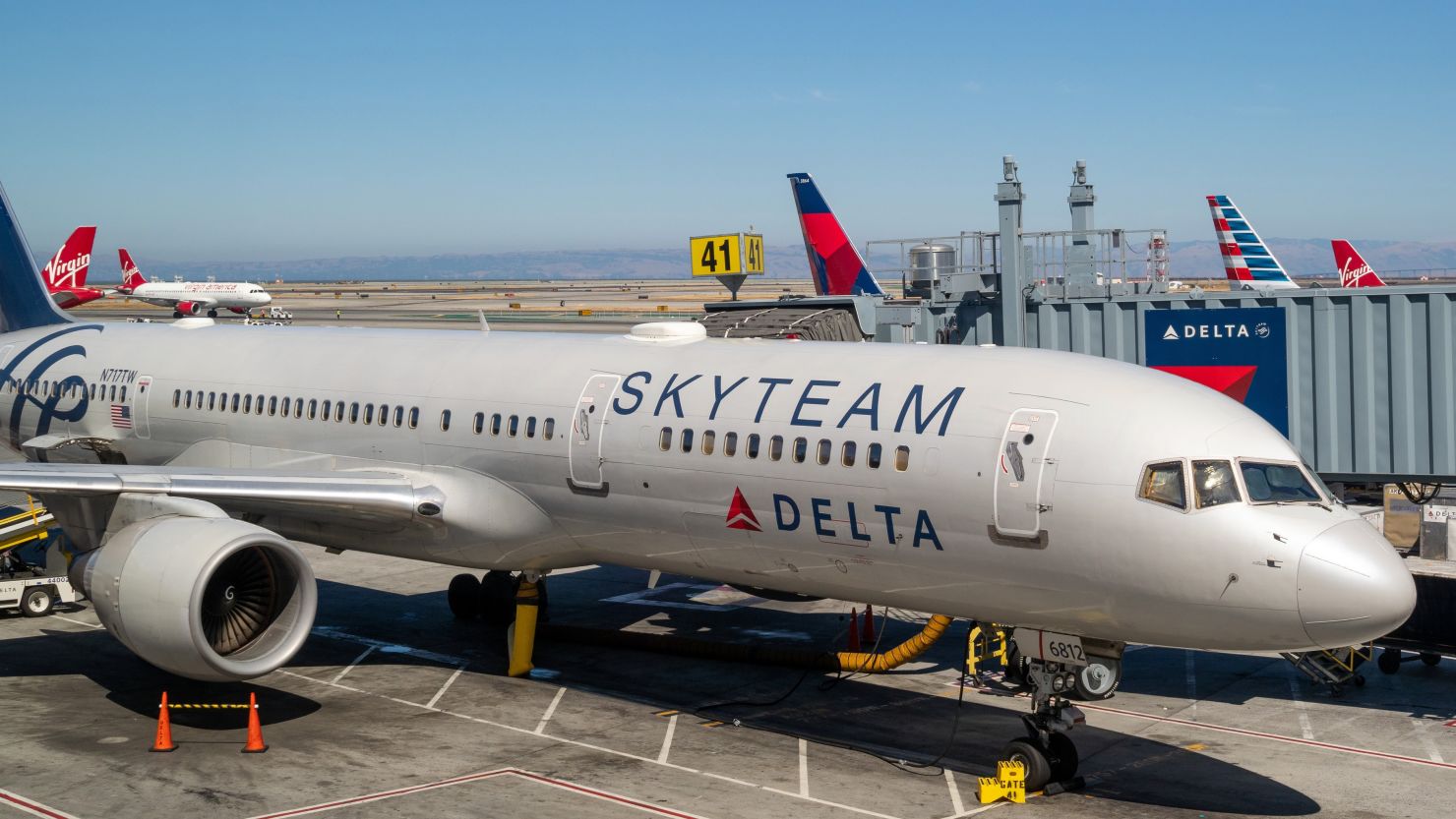 A photo of a Delta Air Lines Boeing 757 at the gate in Denver