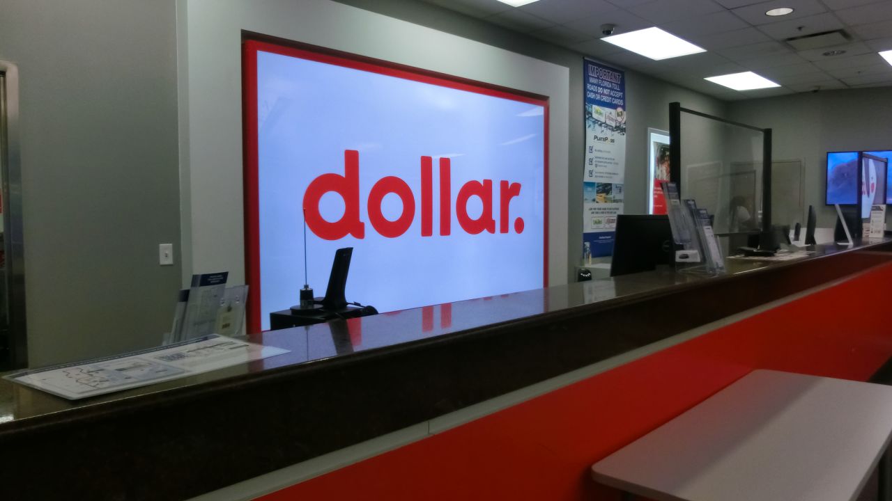 A photo of a Dollar rental car counter in Miami, Florida, USA