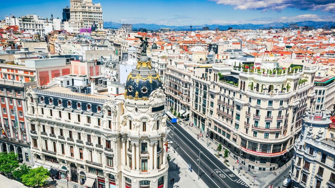 A photo of Madrid's Gran Via street in the day time.