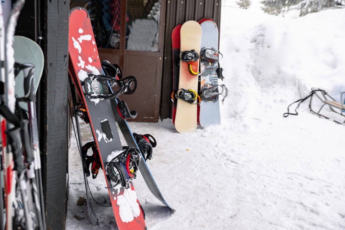 A photo of various ski and snowboarding equipment in a ski resort