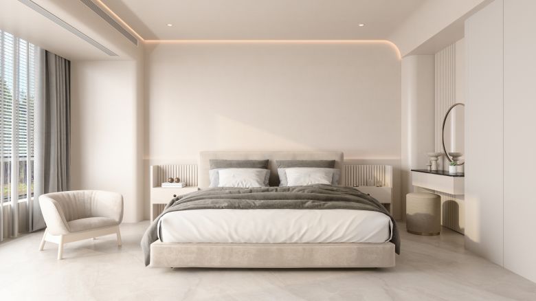 underscored A photo of a luxury hotel room with a large bed and an armchair