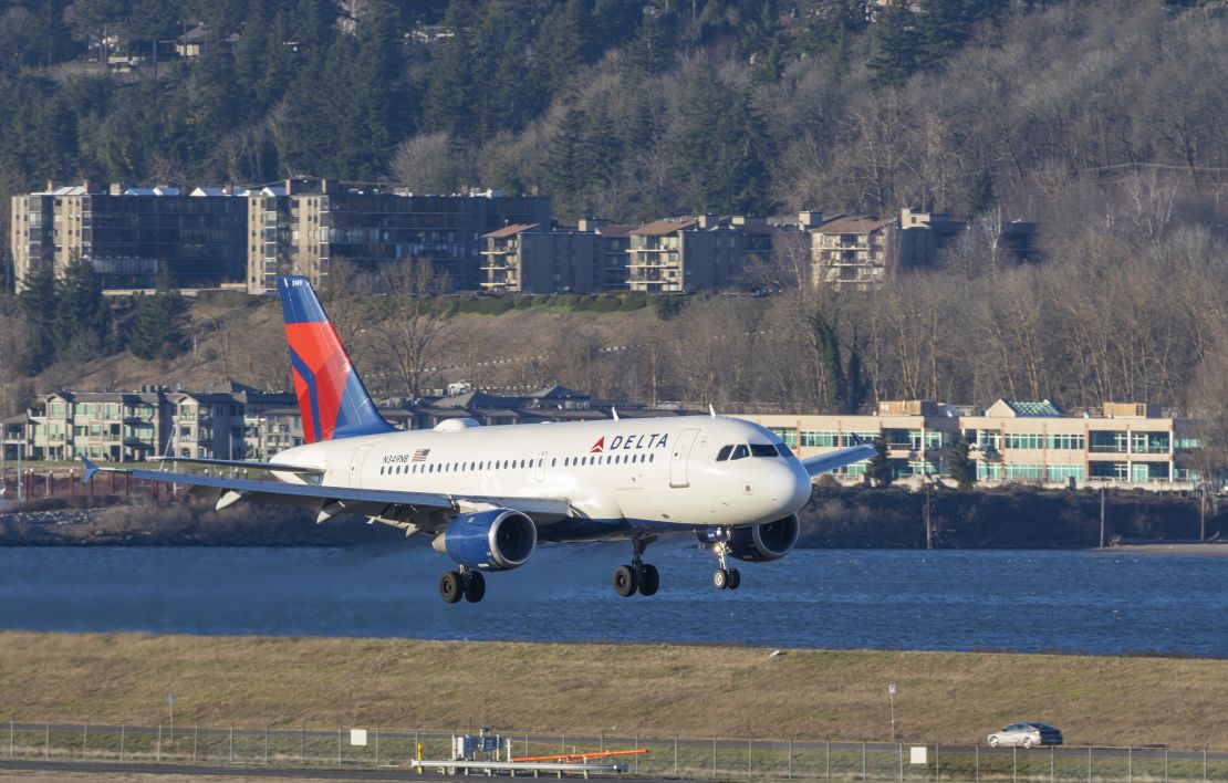 A photo of a Delta Air Lines Airbus A319 landing in Portland International Airport (PDX)