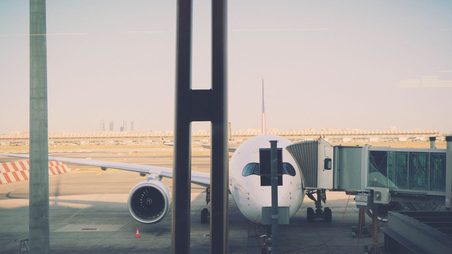 A photo of a plane at the gate in Madrid