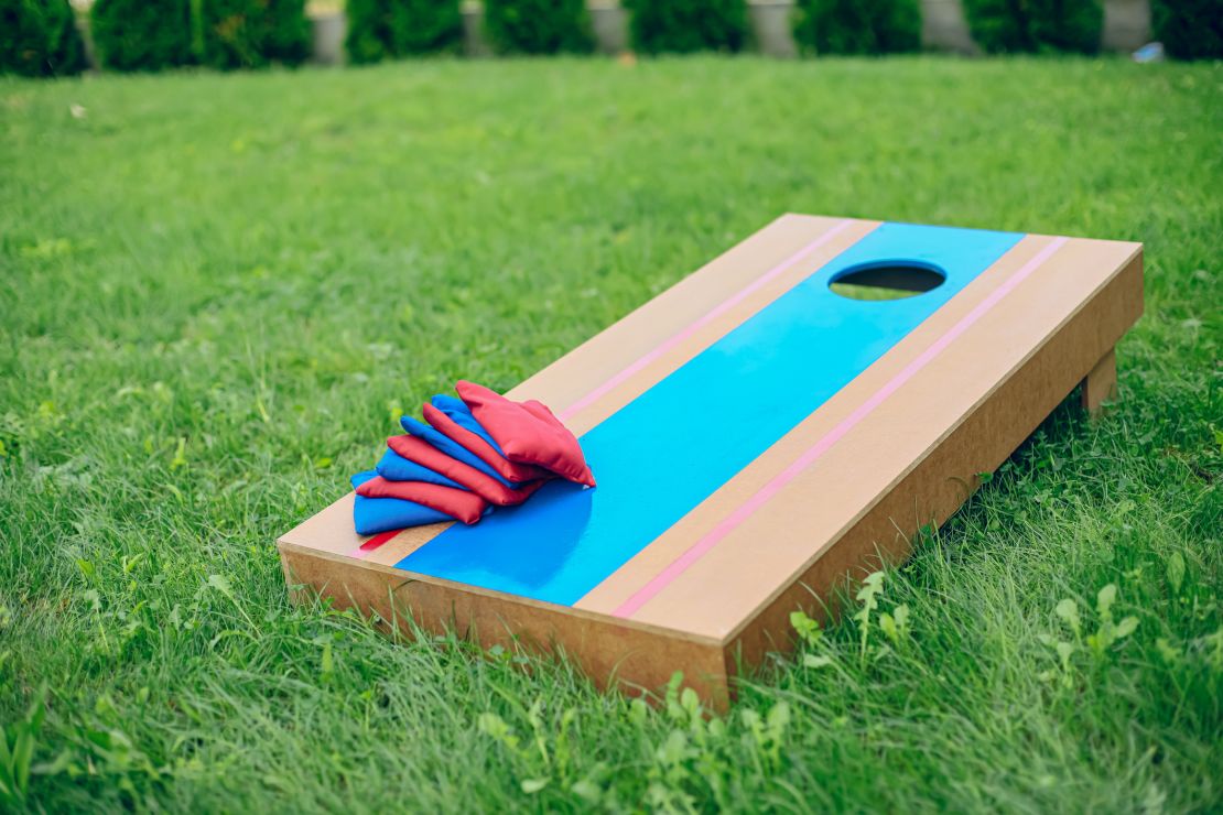 Homemade corn hole board game in backyard