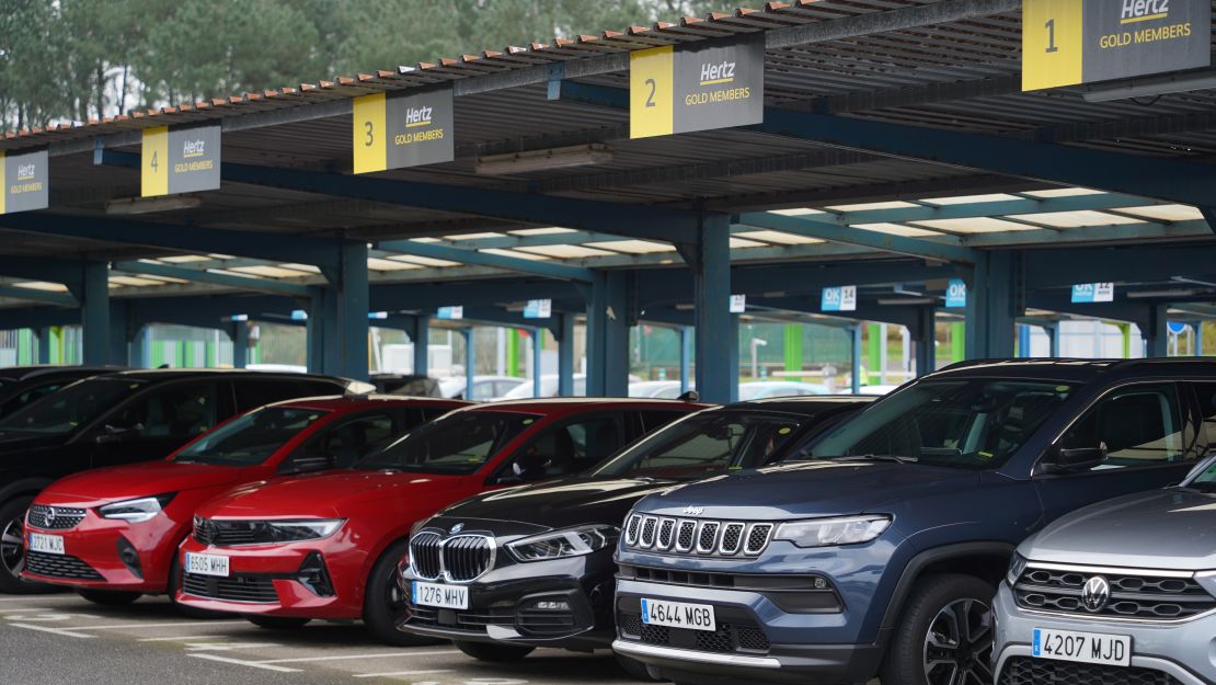 A photo of a row of cars in a Hertz rental car lot in Spain