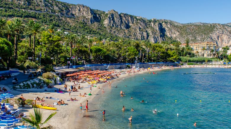 A photo of people on a beach on the French Riviera