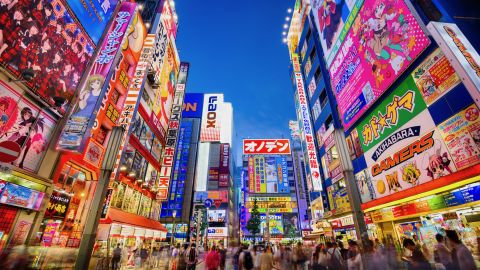 A photo of crowds walking through the Akihabara district of Tokyo, Japan.