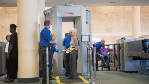 A photo of a person going through a TSA security checkpoint at Las Vegas Harry Reid International Airport (LAS)