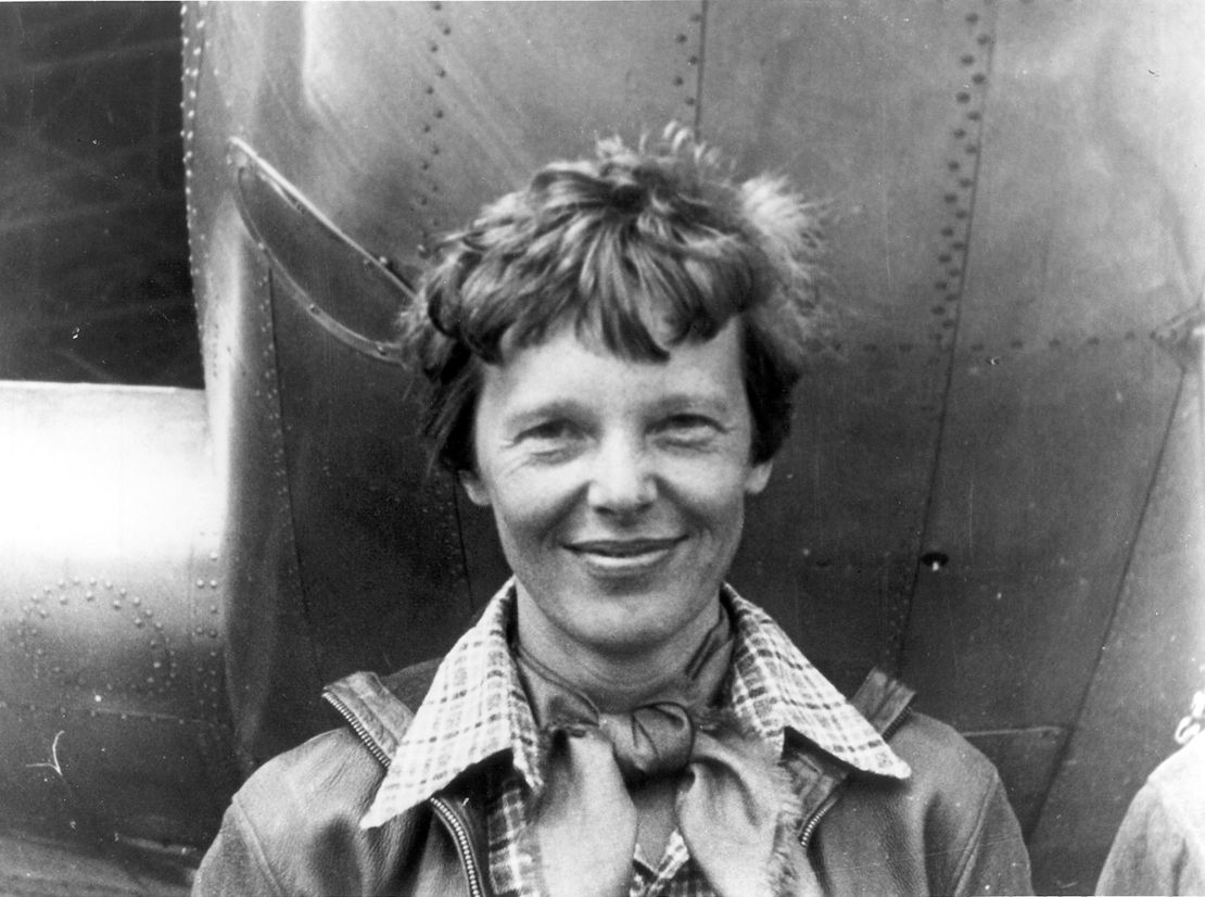 Amelia Earhart is seen with her Lockheed Model 10-E Electra, the last plane she flew before declared missing at sea.