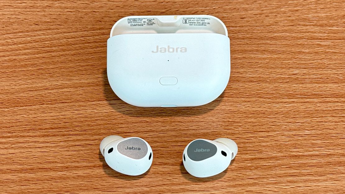 The white Jabra Elite 10 Gen 2 on a table, with the buds in front of the case.