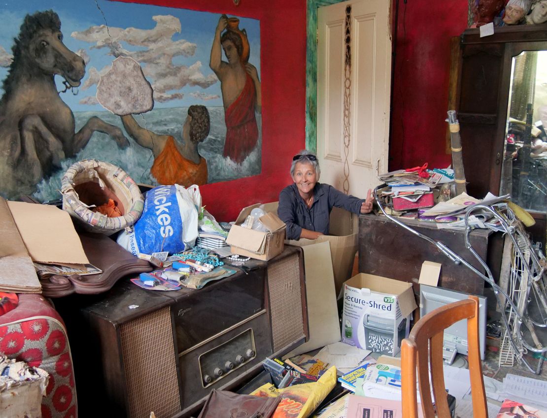 Jan Williams sorts some of the contents of her late uncle's house.