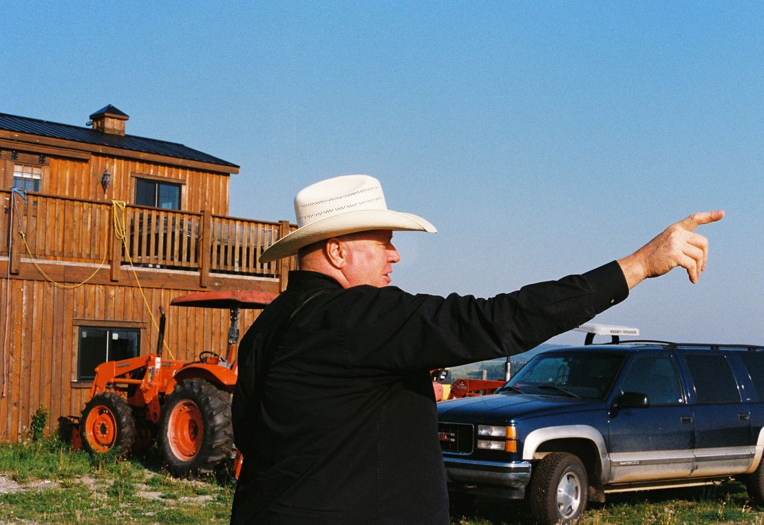 Independence activist Jeffrey Rath gestures towards the horizon on his ranch outside Calgary.