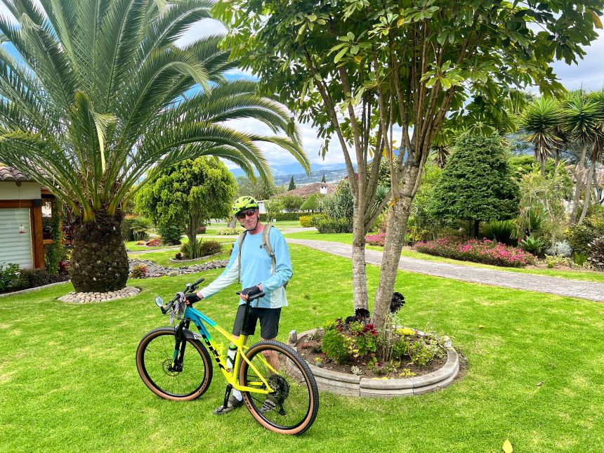 Jeremy, a keen cyclist, poses with his bike in Ecuador.