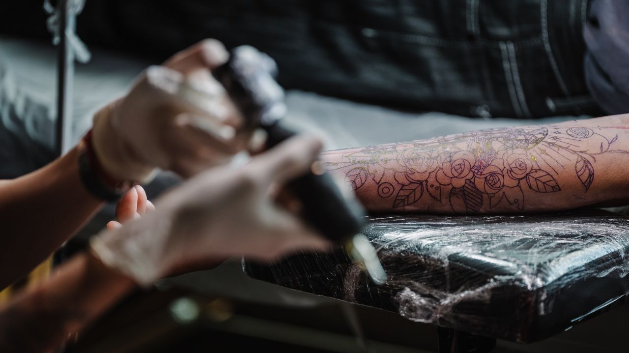 South Korean tattoo artist Hen inks the client’s inner arm according to the stencil at the Moon Blue studio, Youngdeungpo, Seoul, South Korea, Aug 16, 2025.