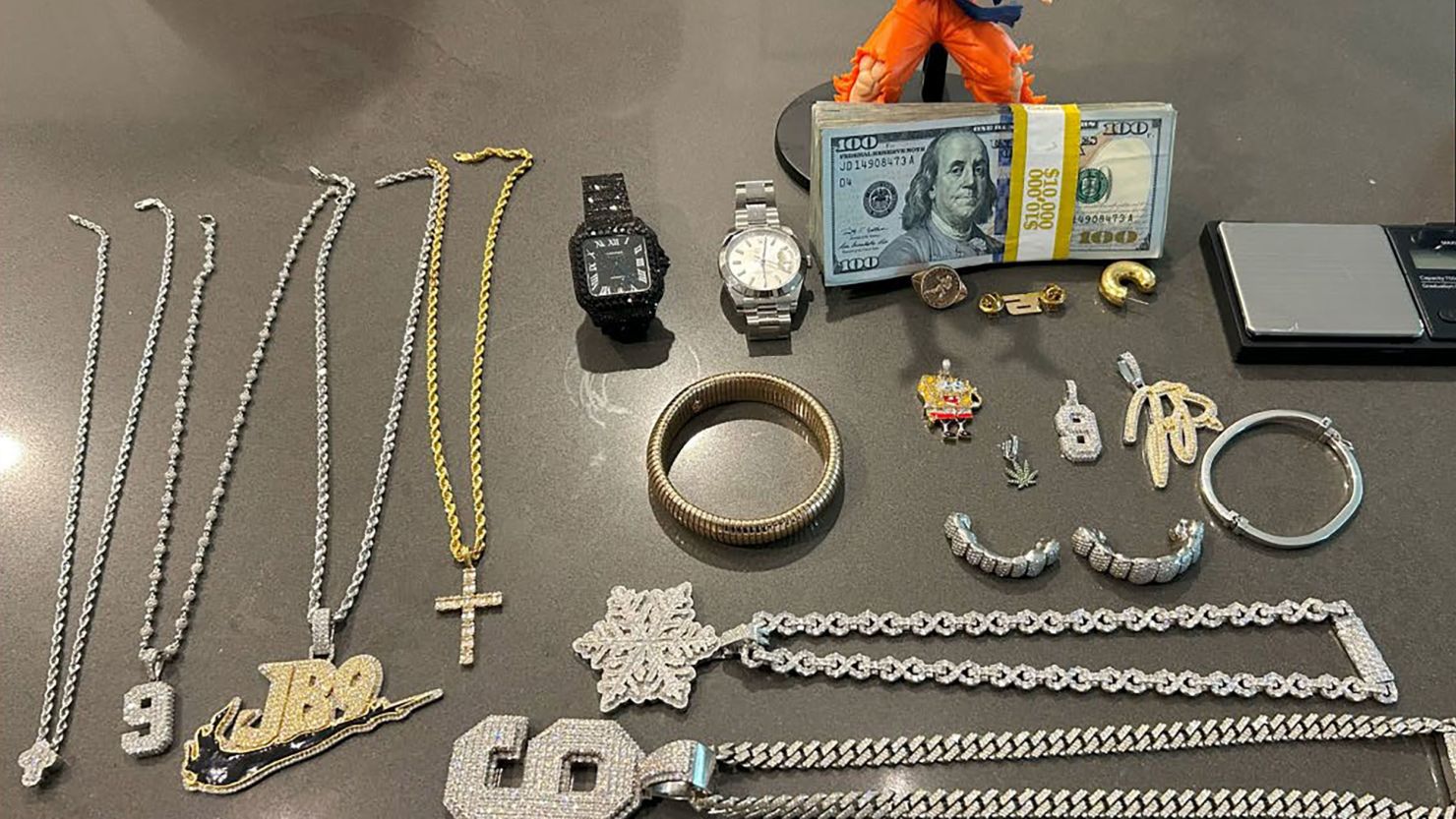 Items stolen from Joe Burrow's home are seen in a photograph recovered from a suspect's phone, according to a federal criminal complaint.