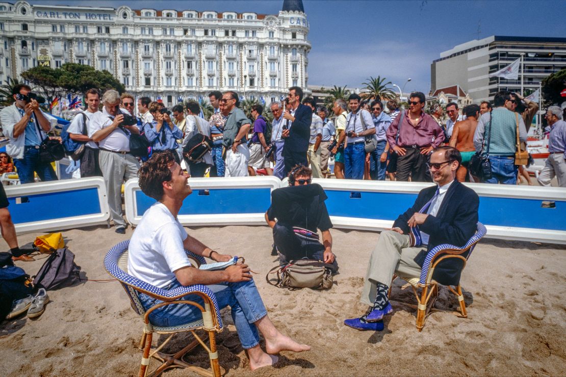 In all his time photographing the festival, Ridgers only ever saw two films — preferring instead to loiter on the beach nearby. "John Waters Interview, Carlton Beach" (1990).